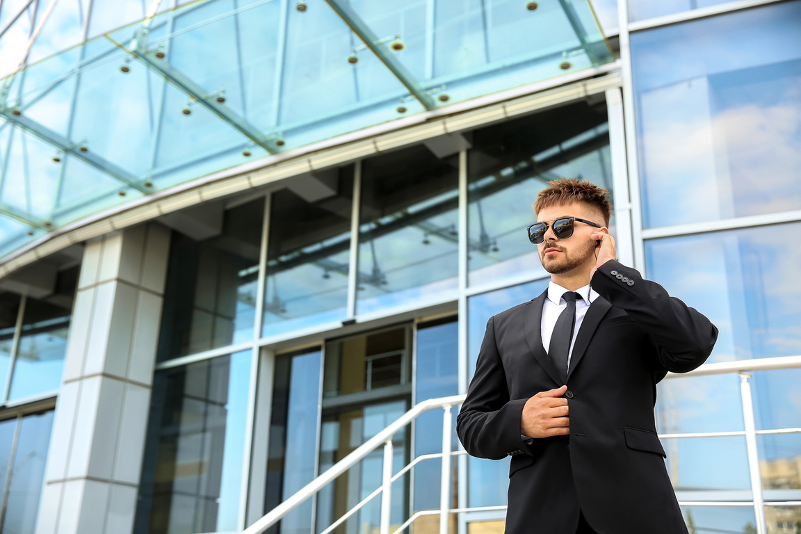 Professional Security Guard near Building Outdoors